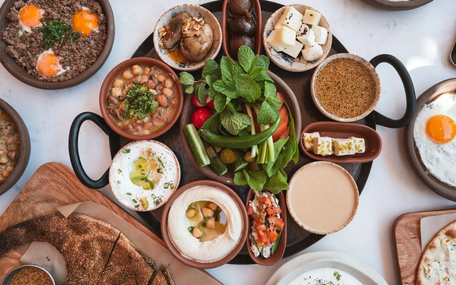 Middle Eastern food — Rolled grape leaves, saffron rice flipped in faith, and hospitality measured in second helpings.